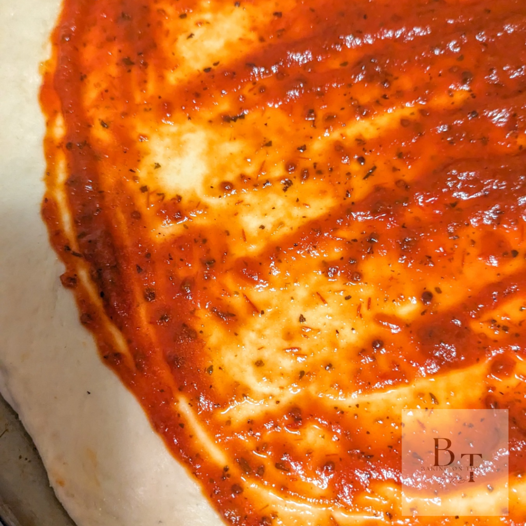 Homemade pizza with pizza sauce