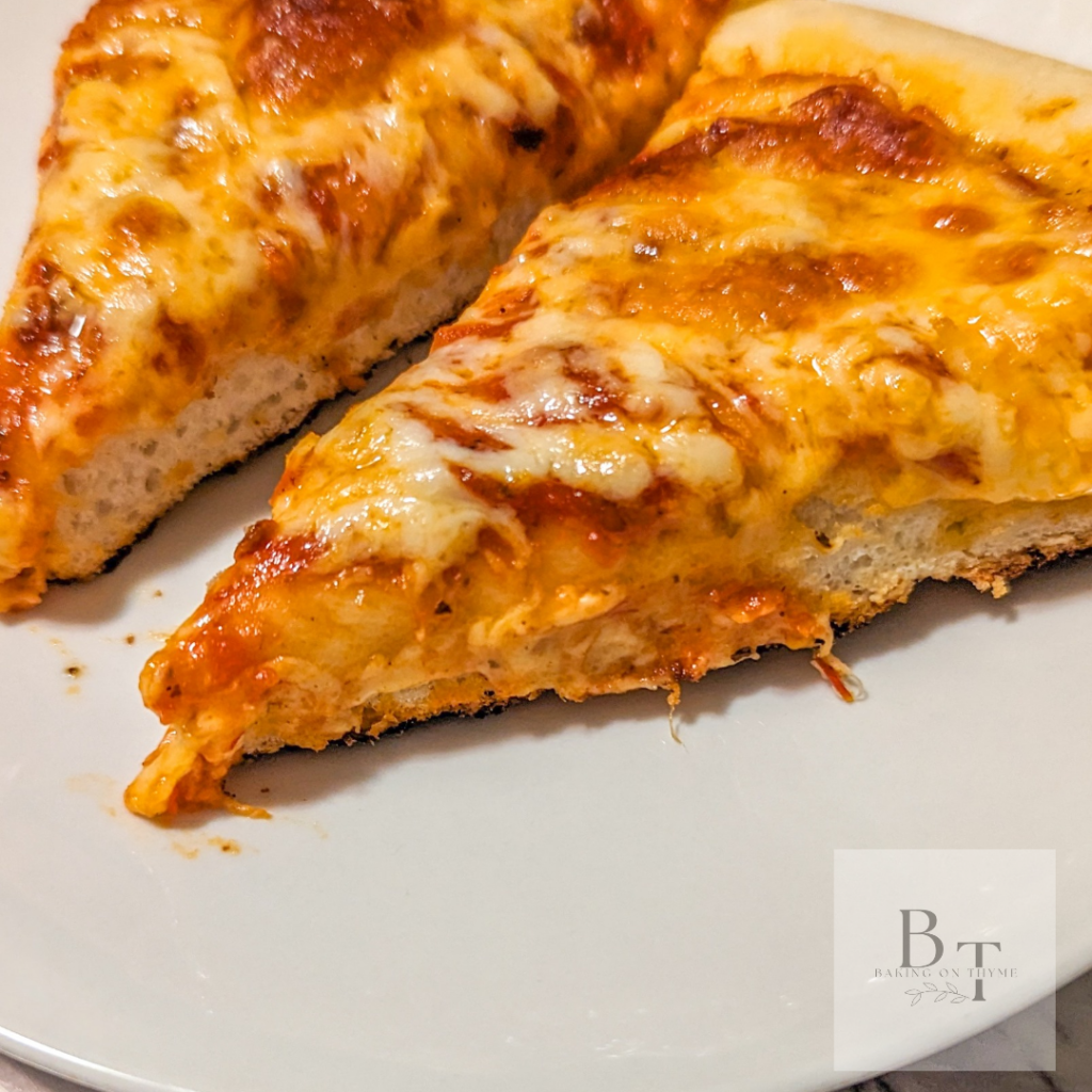 Homemade pizza with pizza sauce and cheese 