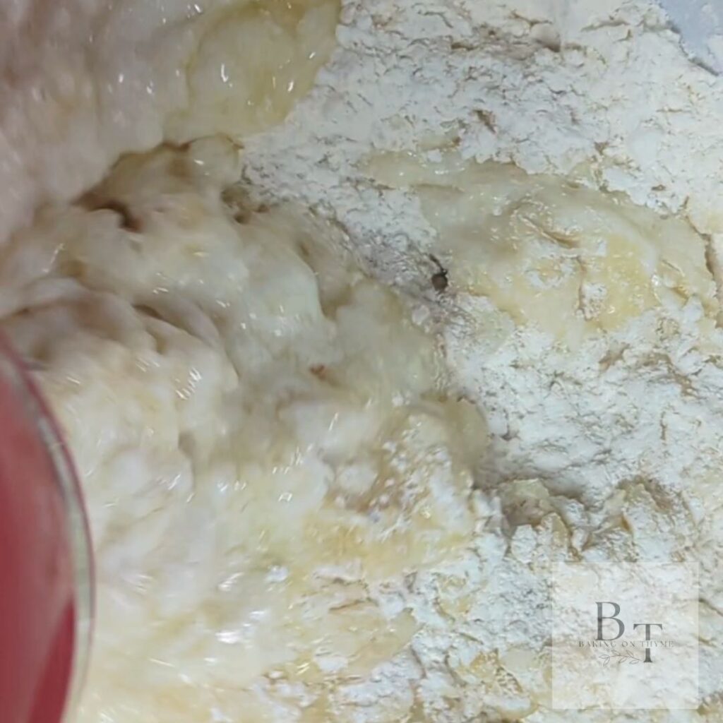 dry ingredients mixing in with wet ingredients