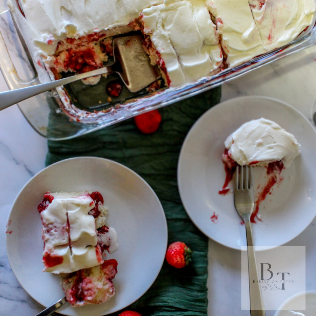 white cake with strawberry filling topped with homemade whipped cream
