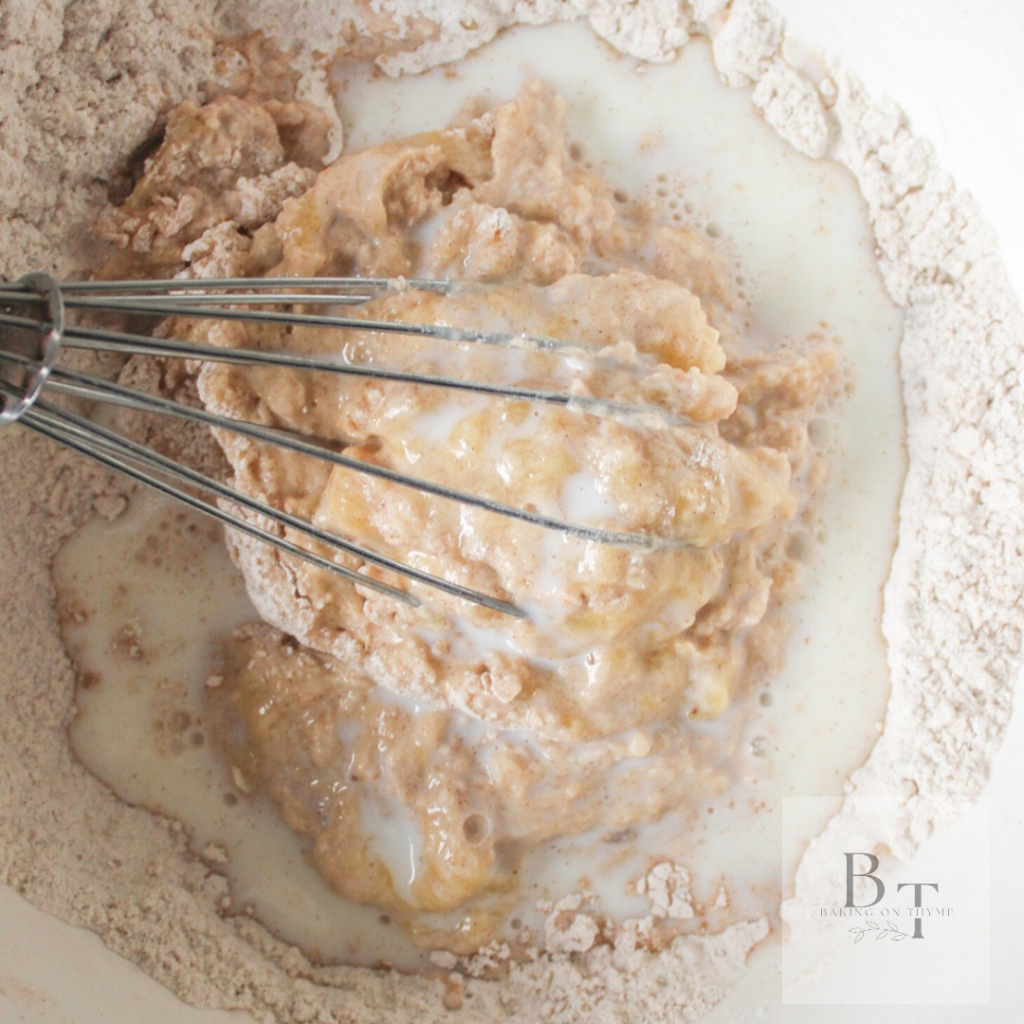 mixing the wet ingredients in a bowl for Homemade Banana Gulgula aka Indian banana fritters batter