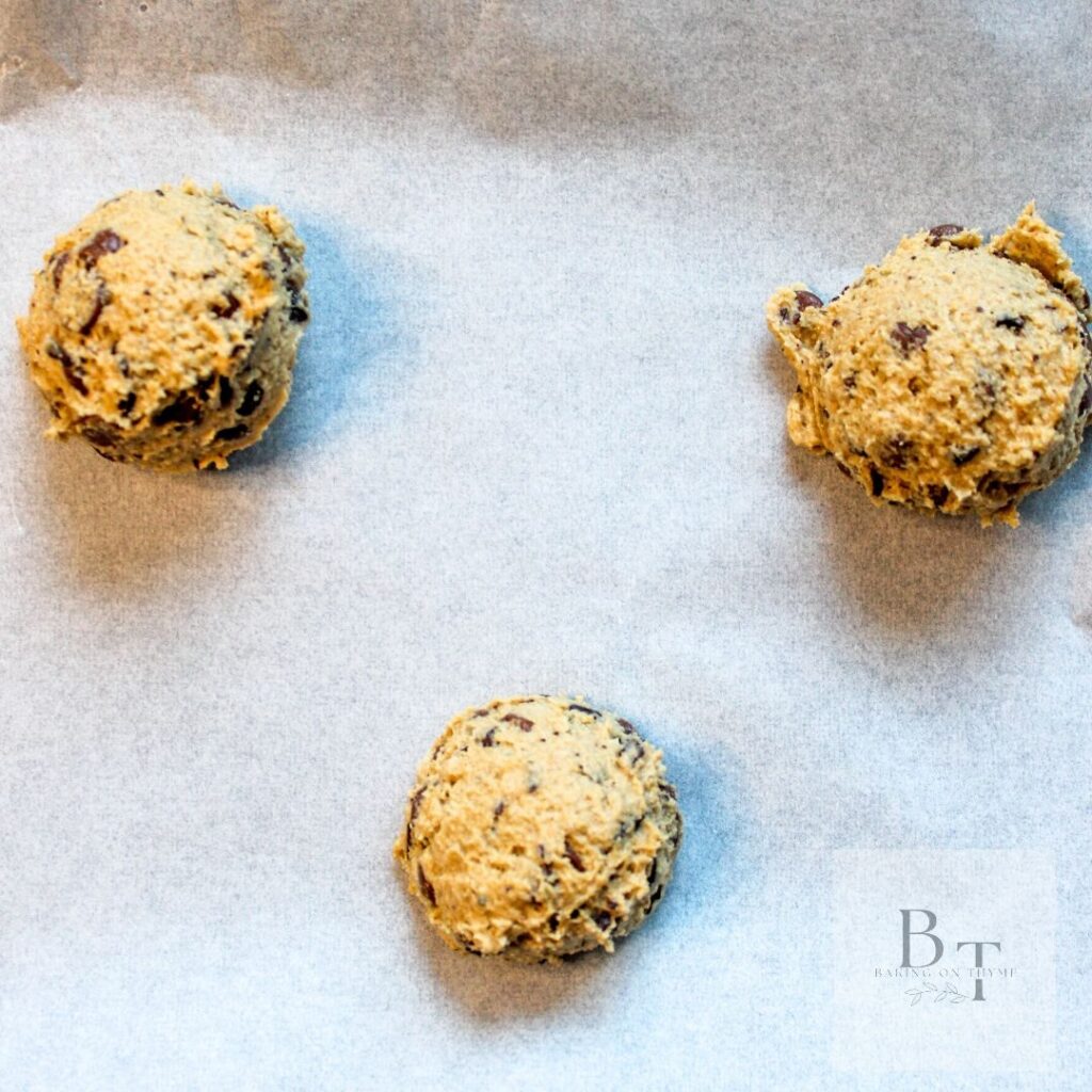 cookie batter scop onto a cookie sheet - baking on thyme