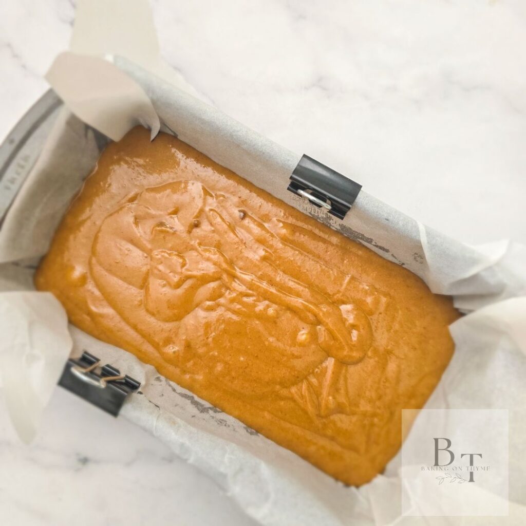 pumpkin bread liquid mixture in bread loaf